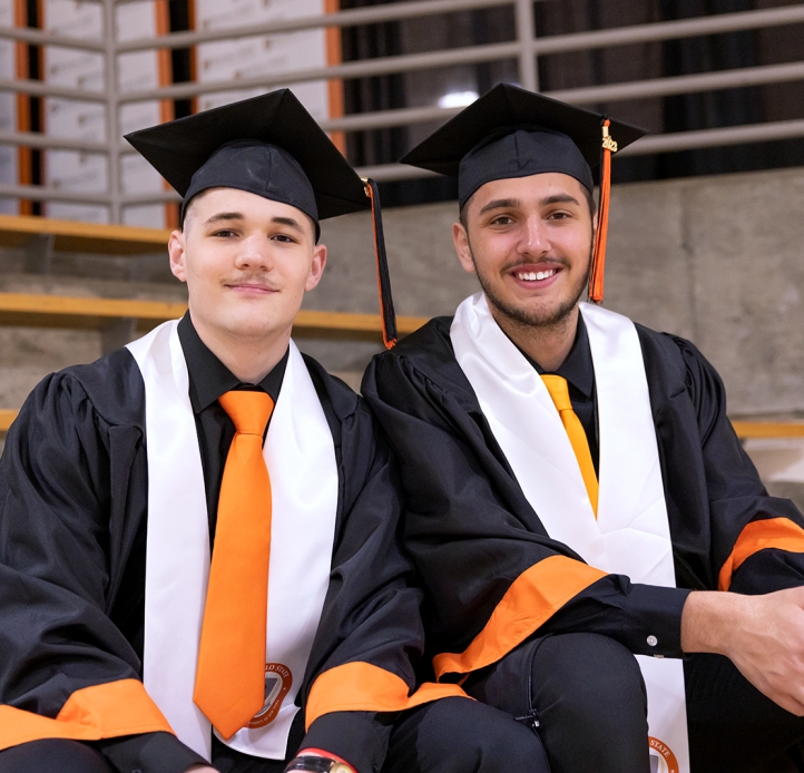 Two Commencement students smiling