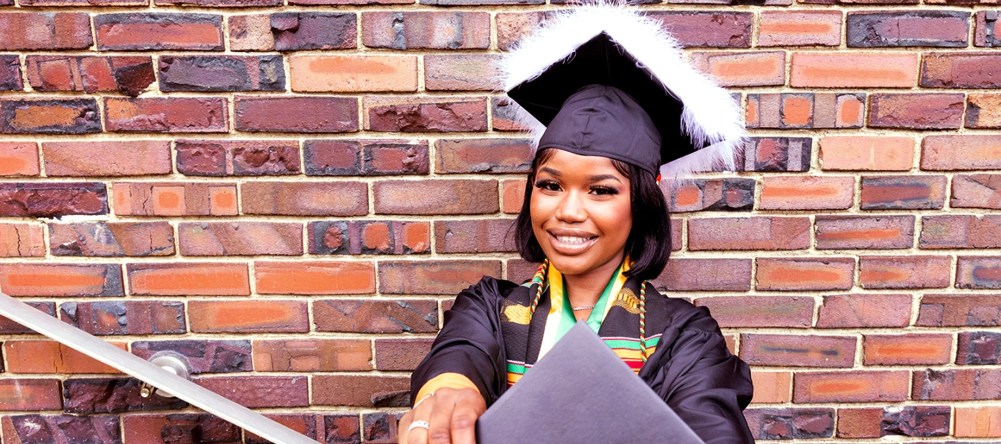 Student holding her diploma