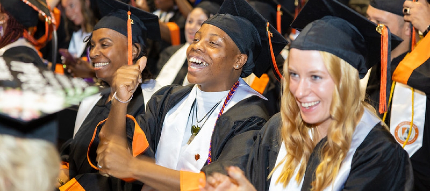 Students cheering at commencement ceremony